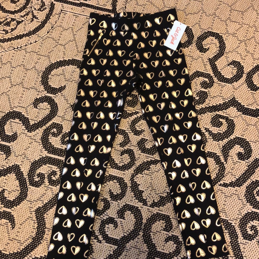 Black pants with gold hearts